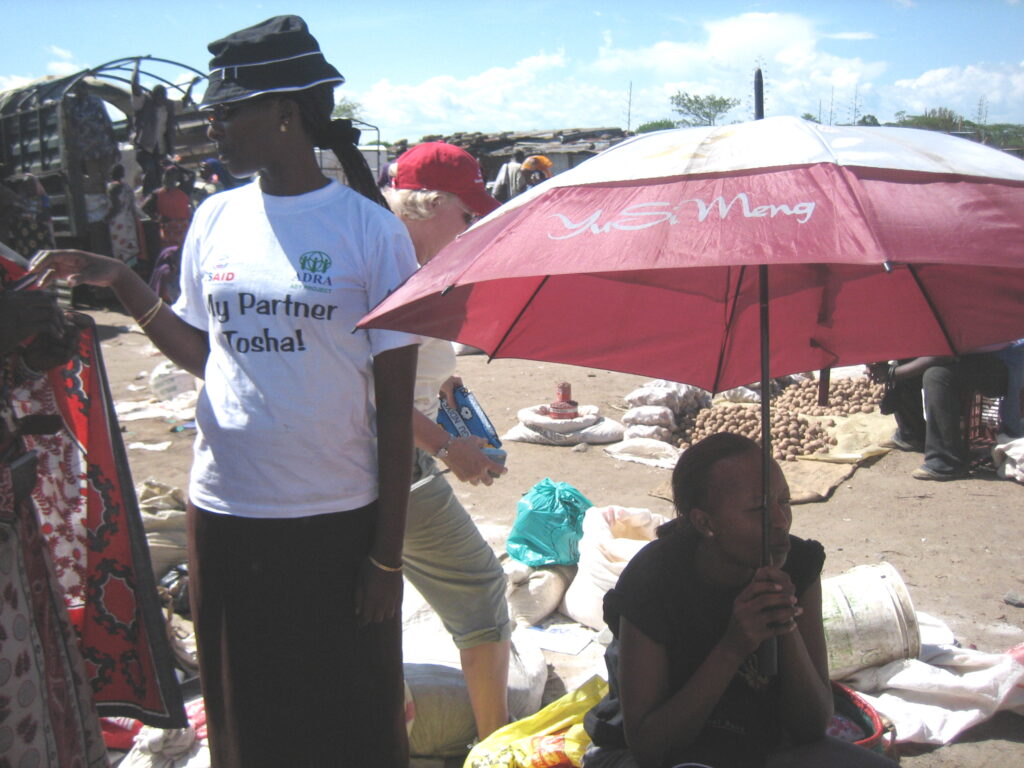 Buying lessos at the open market in Talek 