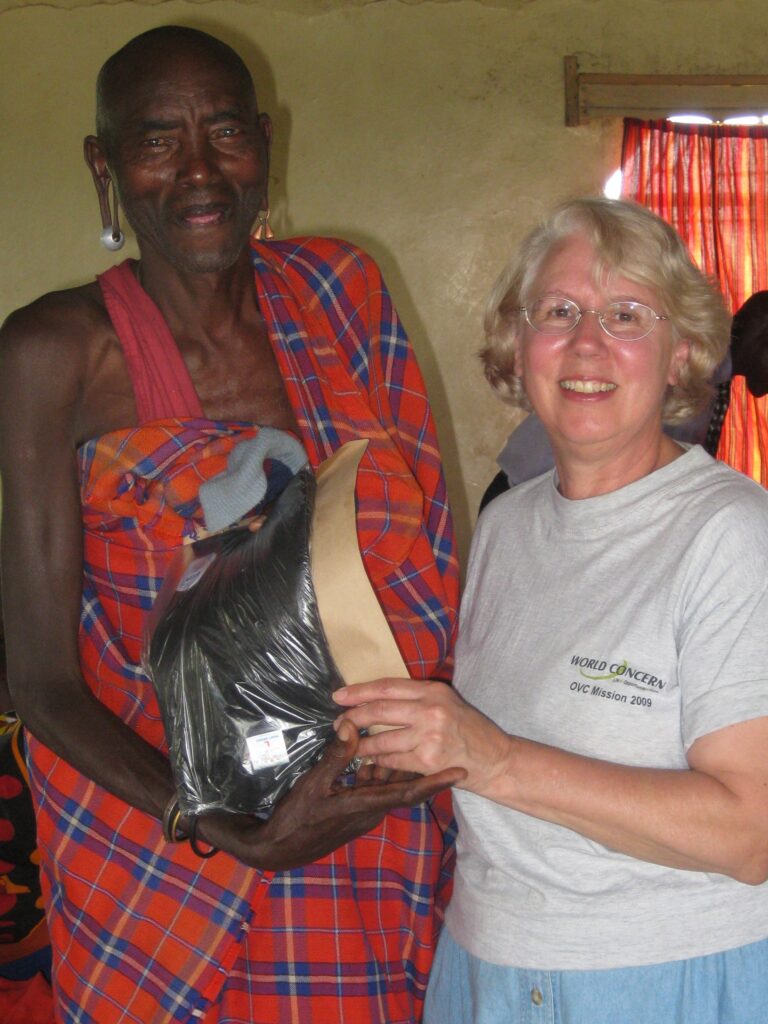 Ginger presenting the award to a local volunteer